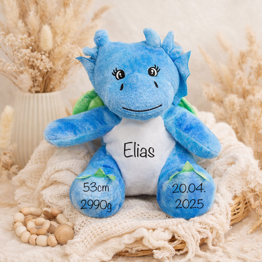 Dino Kuscheltier mit Name und Geburtsdatum in blau für Jungen zur Geburt, Geburtstag oder saisonalen Anlässen.