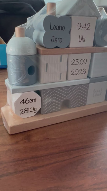 Stacking house with engraving of birth dates